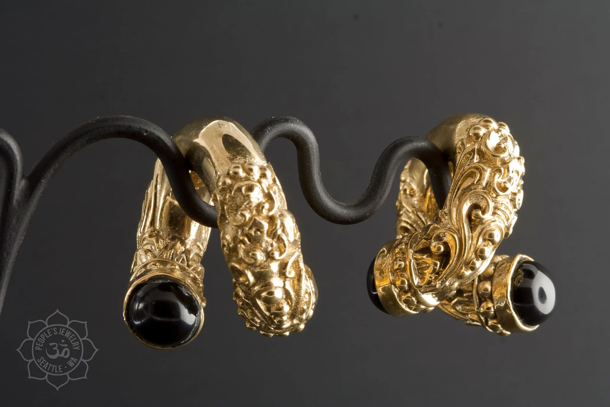 Intricate Brass Coils with Onyx by People's Jewelry - Image 2